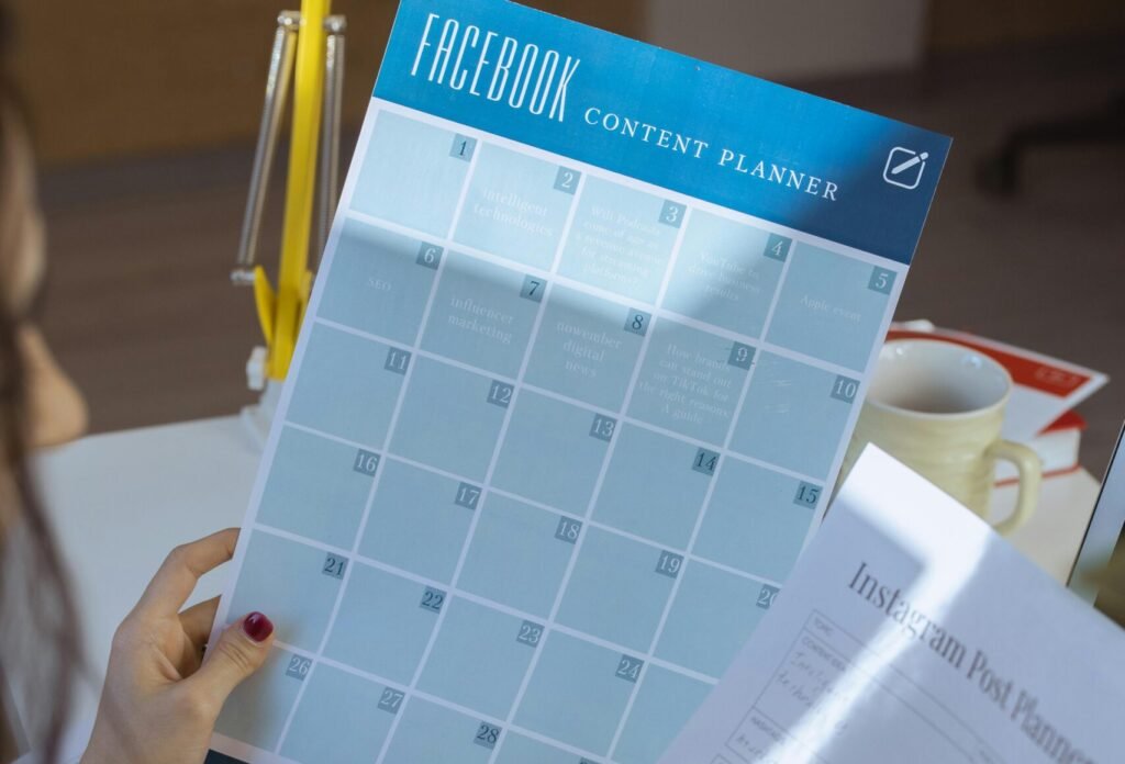 Businesswoman organizing social media strategy with content planners in a home office.